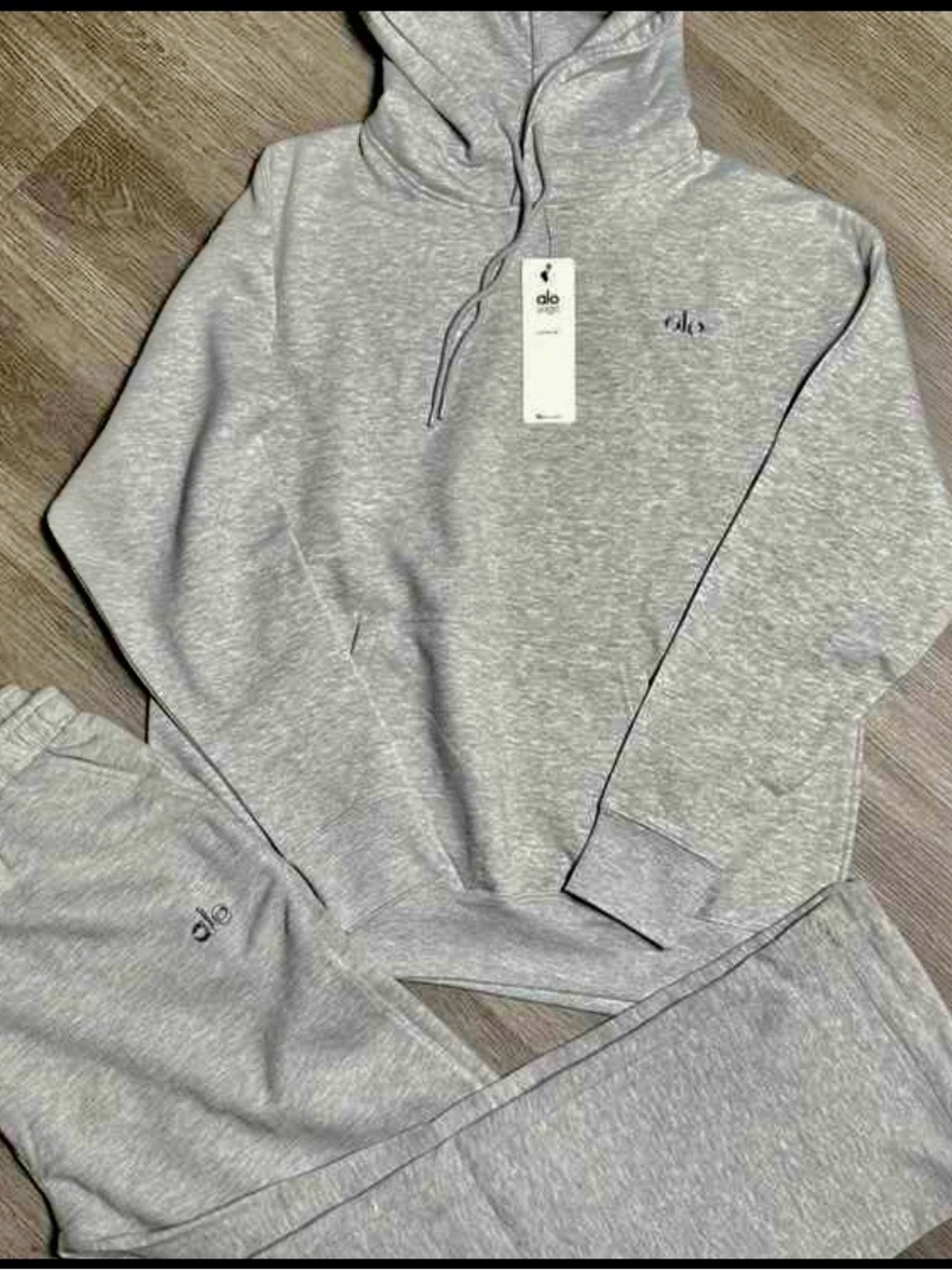 Grey matching pants and sweater set, size M.
